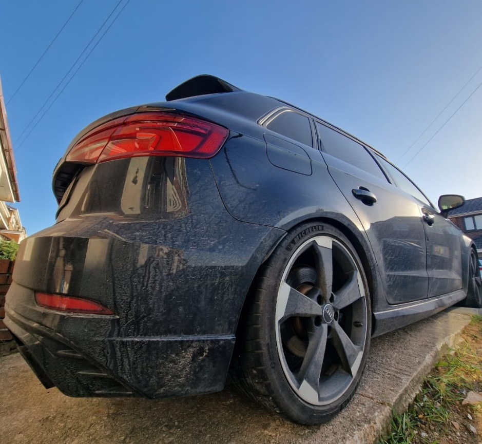 Dusty grey Audi RS3 Sportback before detailing, showing road grime and water spots