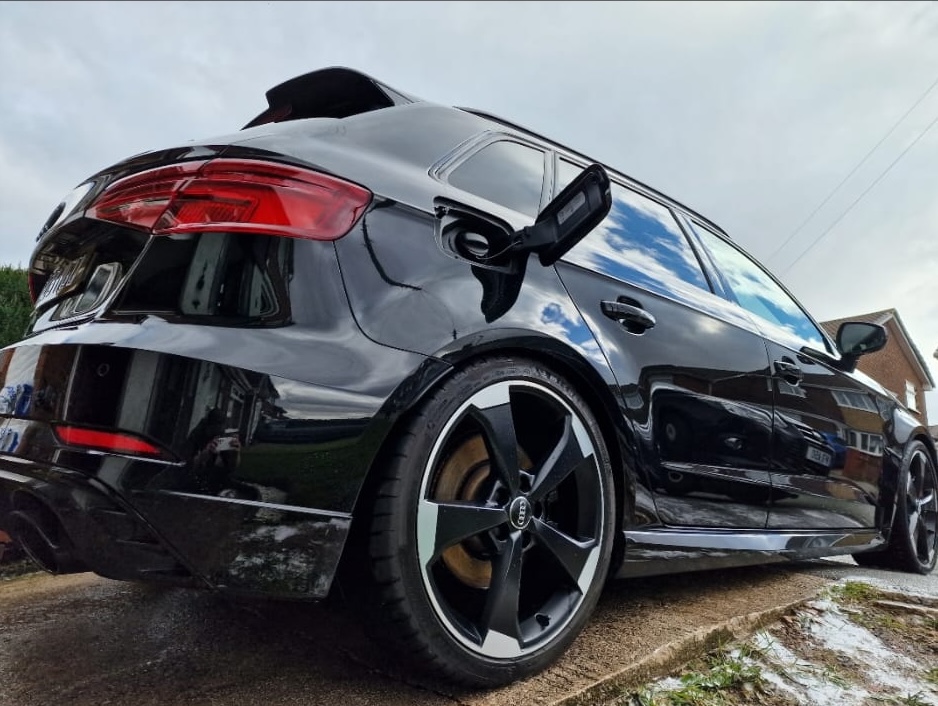 Black Audi RS3 Sportback detailed to a mirror finish on a driveway with diamond-cut alloys